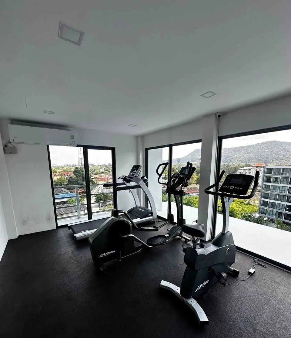 Gym with treadmills and large windows
